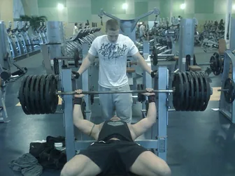 Boyd Myers on the bench press with a spotter